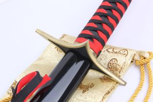 Tsuba - Rojuro Otoribashi's Sword from the Bleach Anime Series: 1045 Carbon Steel Blade with Hamon, Black Glossy Saya, Red & Black Rayon Handle, Zinc Alloy Fittings